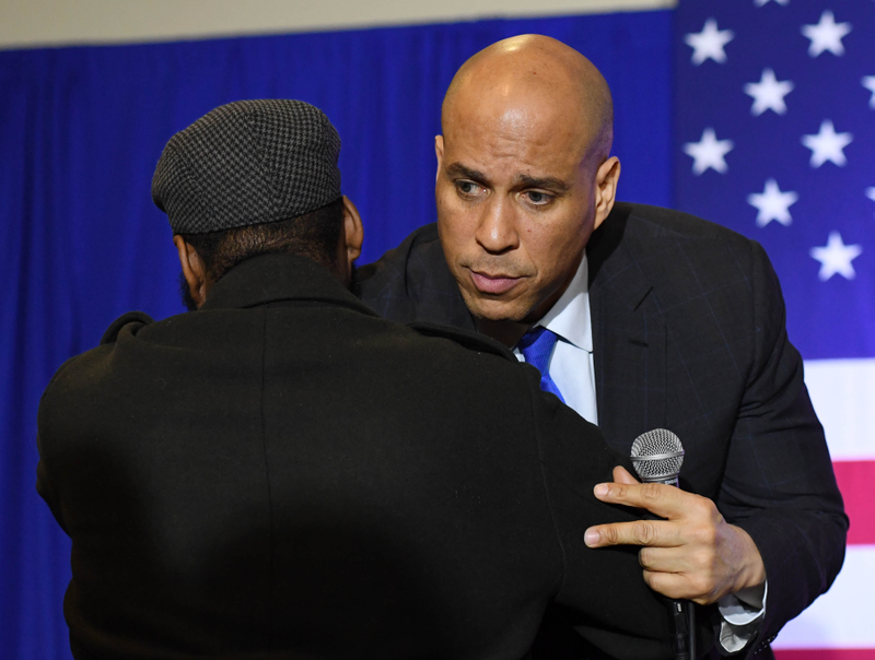 Cory Booker (D-NJ) (R) greets a person who asked a question during Booker’s ‘Conversation with Cory’ campaign event at the Nevada Partners Event Center on February 24, 2019 in North Las Vegas, Nevada. Booker is campaigning for the 2020 Democratic nomination for president.